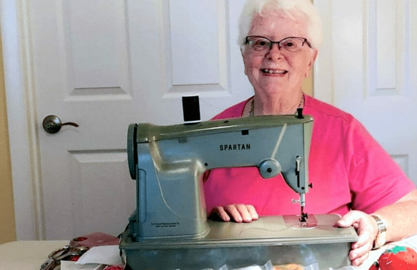 woman behind sewing machine
