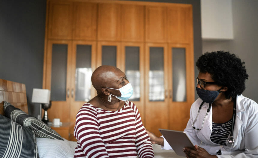 Female doctor consults with female patient