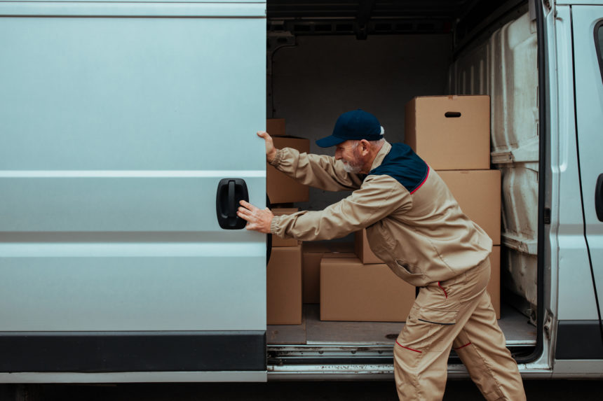 Man opening door of moving van