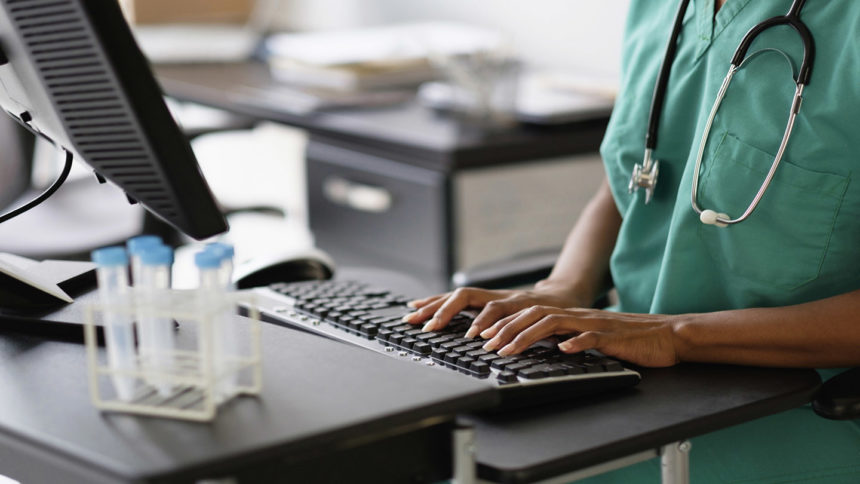 healthcare worker working at computer