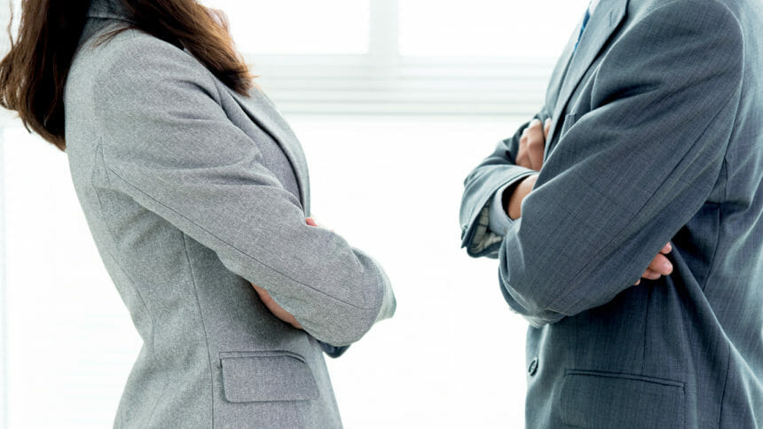 Two businesspeople standing face to face
