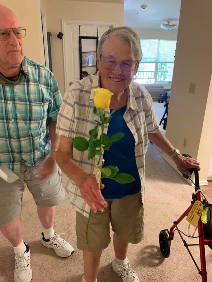 woman holding welcome rose