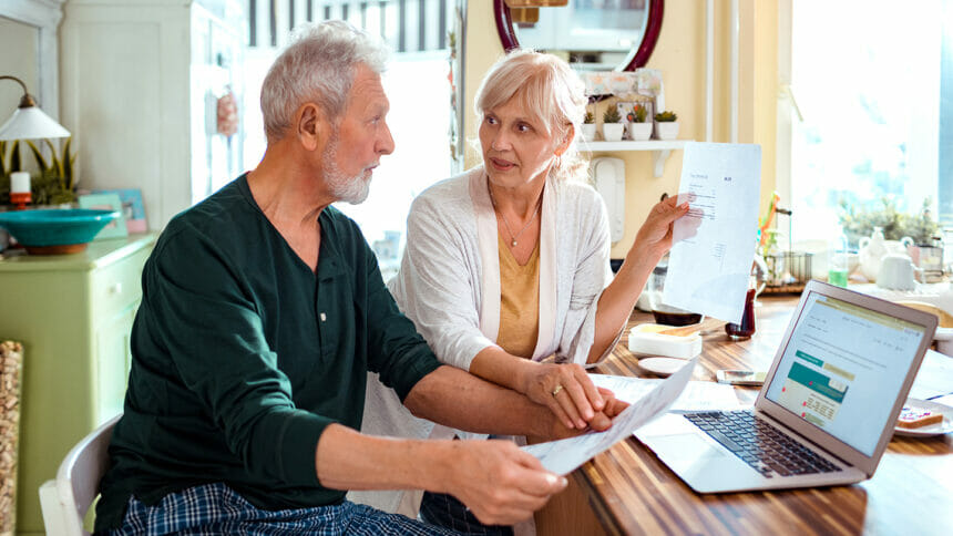 Close up of a senior couple doing home finances