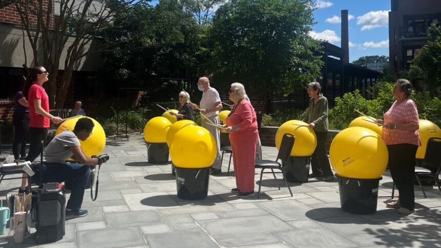 older adults drumming outside