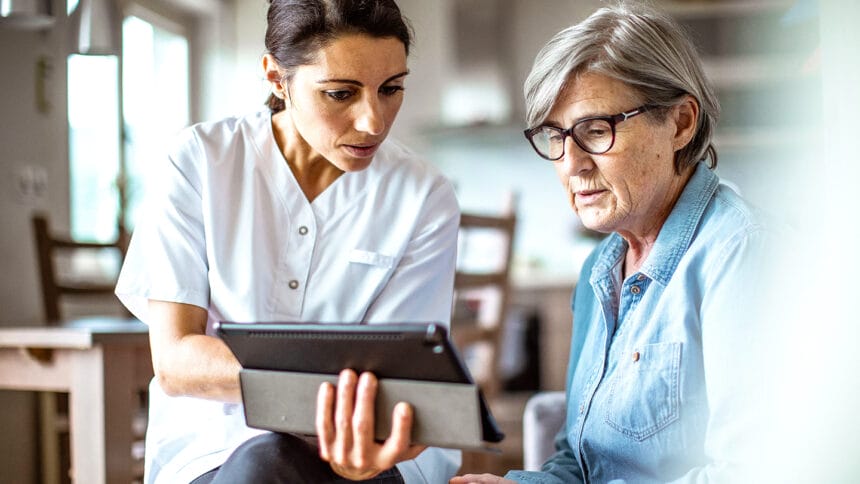 Nurse visiting a senior patient at home