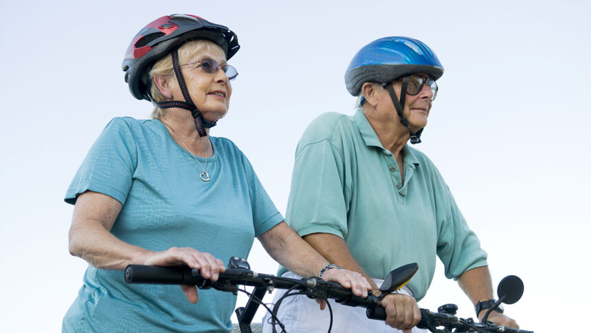 older male and female bicycle riders