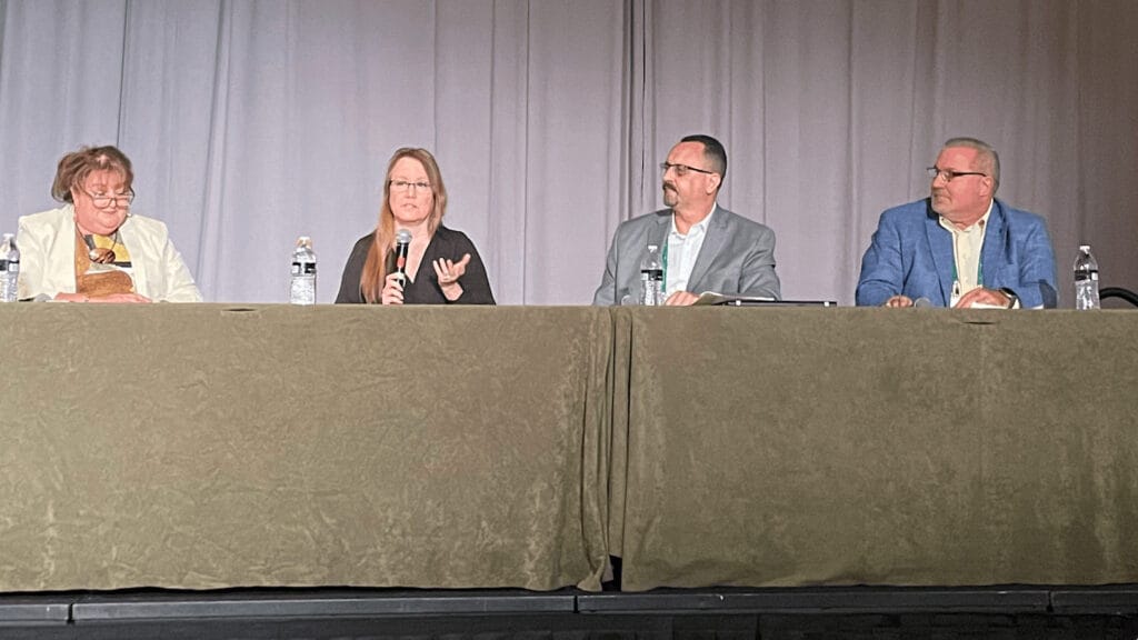 Four people on a speaking panel