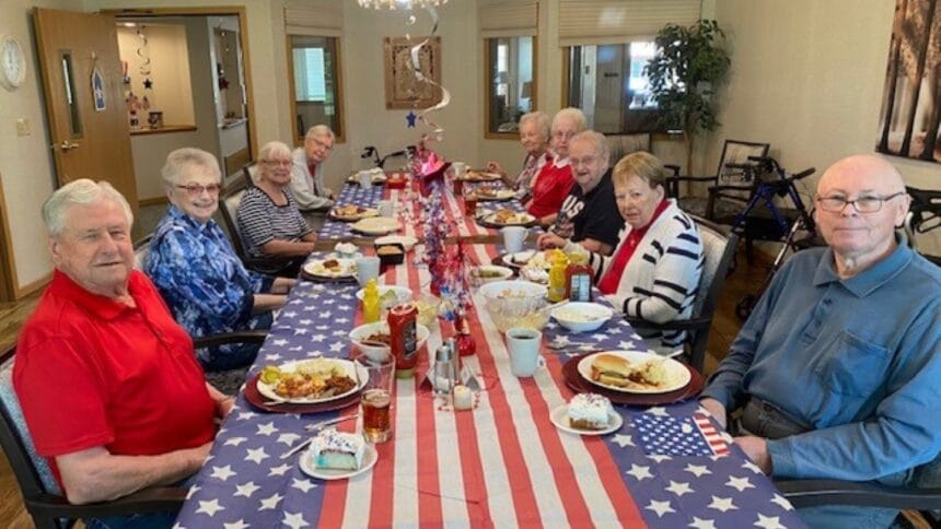 older adults sitting at a table eating