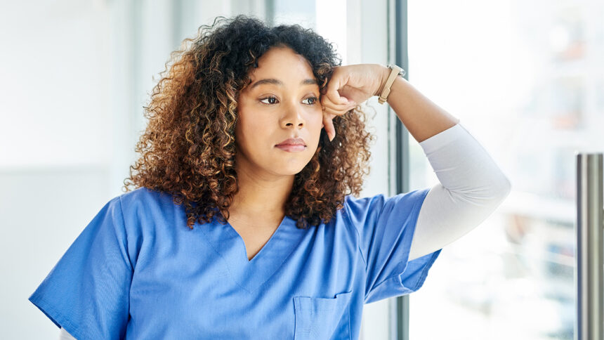 Shot of an attractive young female nurse looking worried at a hospital