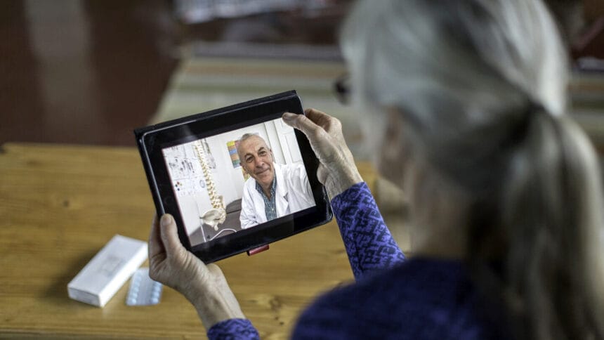 Woman at home having online consultation with doctor