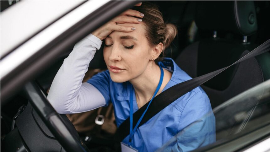 healthcare worker with hand on head