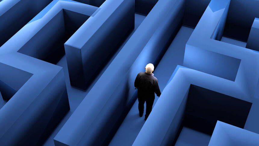 High angle view of male figure walking through maze. Wandering between grey shaded walls and trying to get out. 3D illustration.