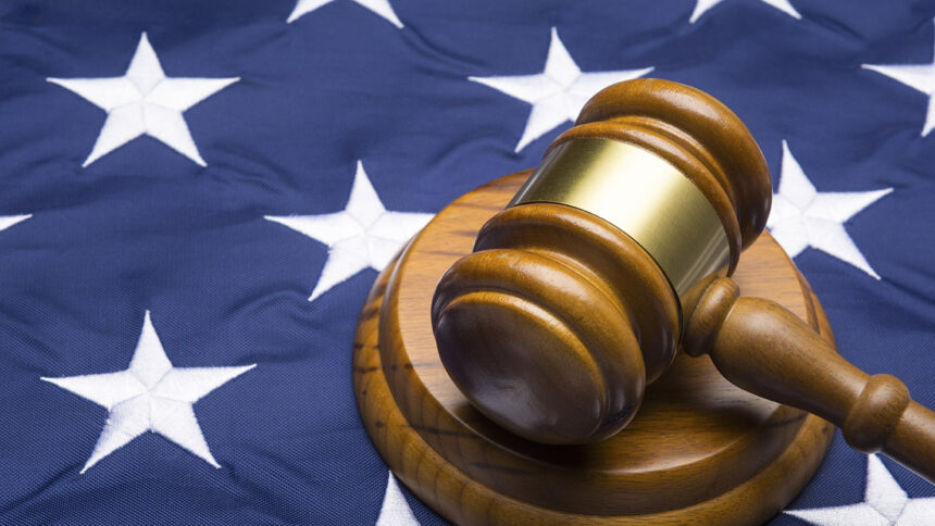 Gavel on American flag, close up