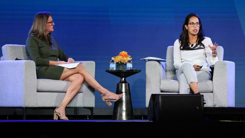 Lisa McCracken and Dianne Munever sitting on a stage.