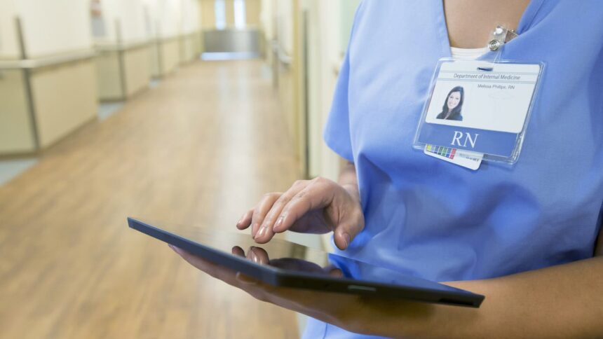 nurse using tablet computer