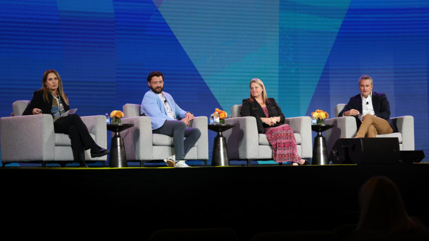 People in chairs on a stage