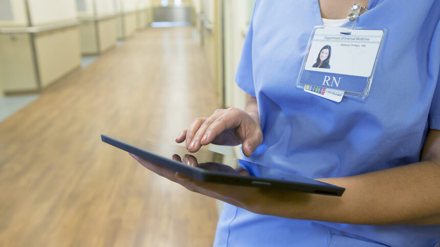 healthcare worker using tablet computer