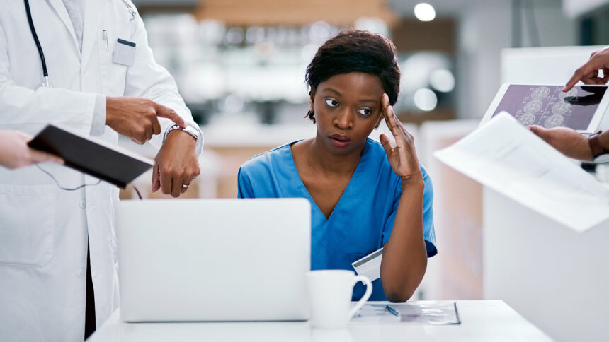 healthcare worker at desk