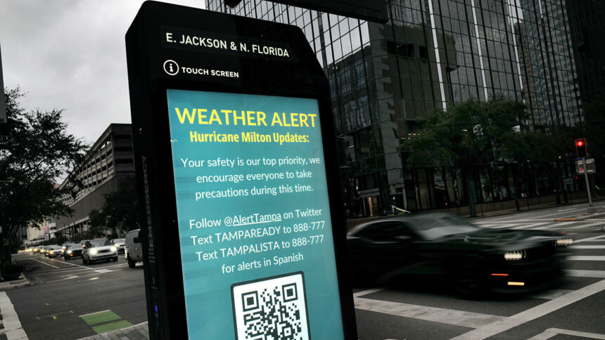 TAMPA, FLORIDA - OCTOBER 07: A weather alert is displayed along a sidewalk as Hurricane Milton churns in the Gulf of Mexico on October 07, 2024 in Tampa, Florida. Milton, which comes on heels of the destructive Hurricane Helene, has strengthened to a Category 5 storm as it approaches Florida’s Gulf Coast near Tampa, where it is projected to make landfall Wednesday. (Photo by Spencer Platt/Getty Images)